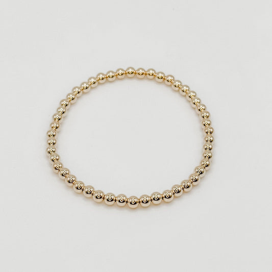 4mm gold beads on a stretch band bracelet