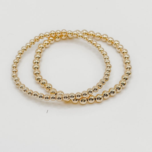 4mm gold beads on a stretch band bracelet. 2  bracelets