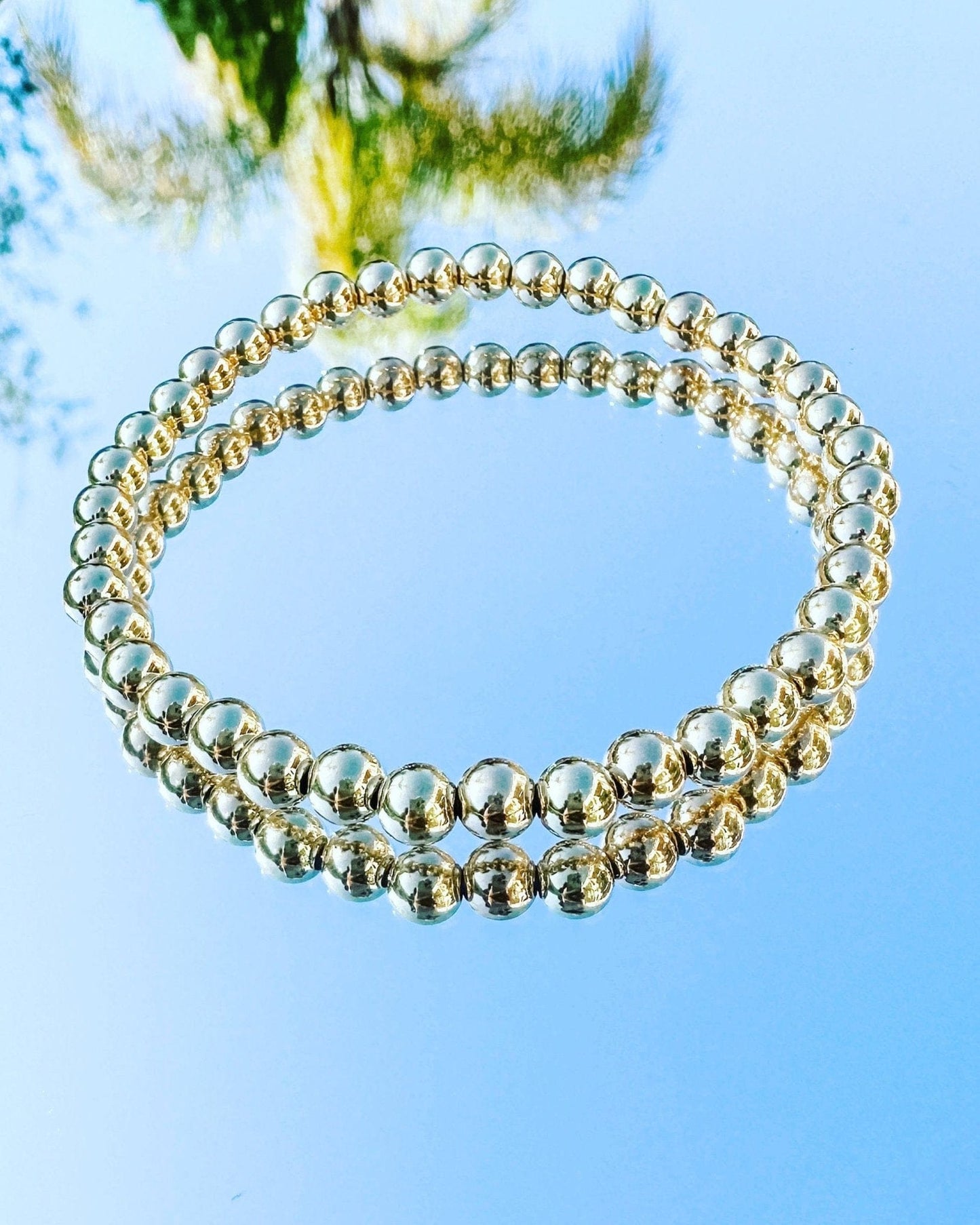 14K Gold Filled Stackable Beaded Bracelet 5MM beads on mirror with sky reflection