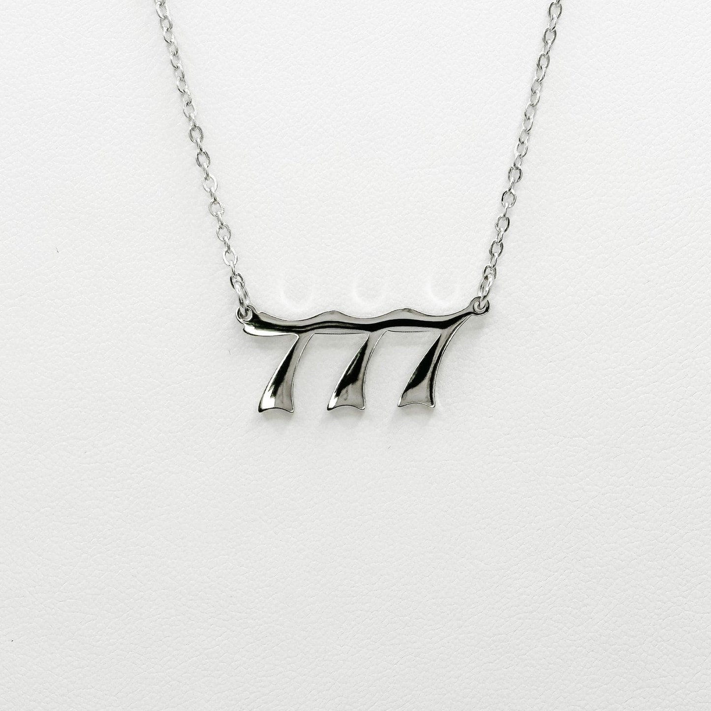 silver 777 necklace