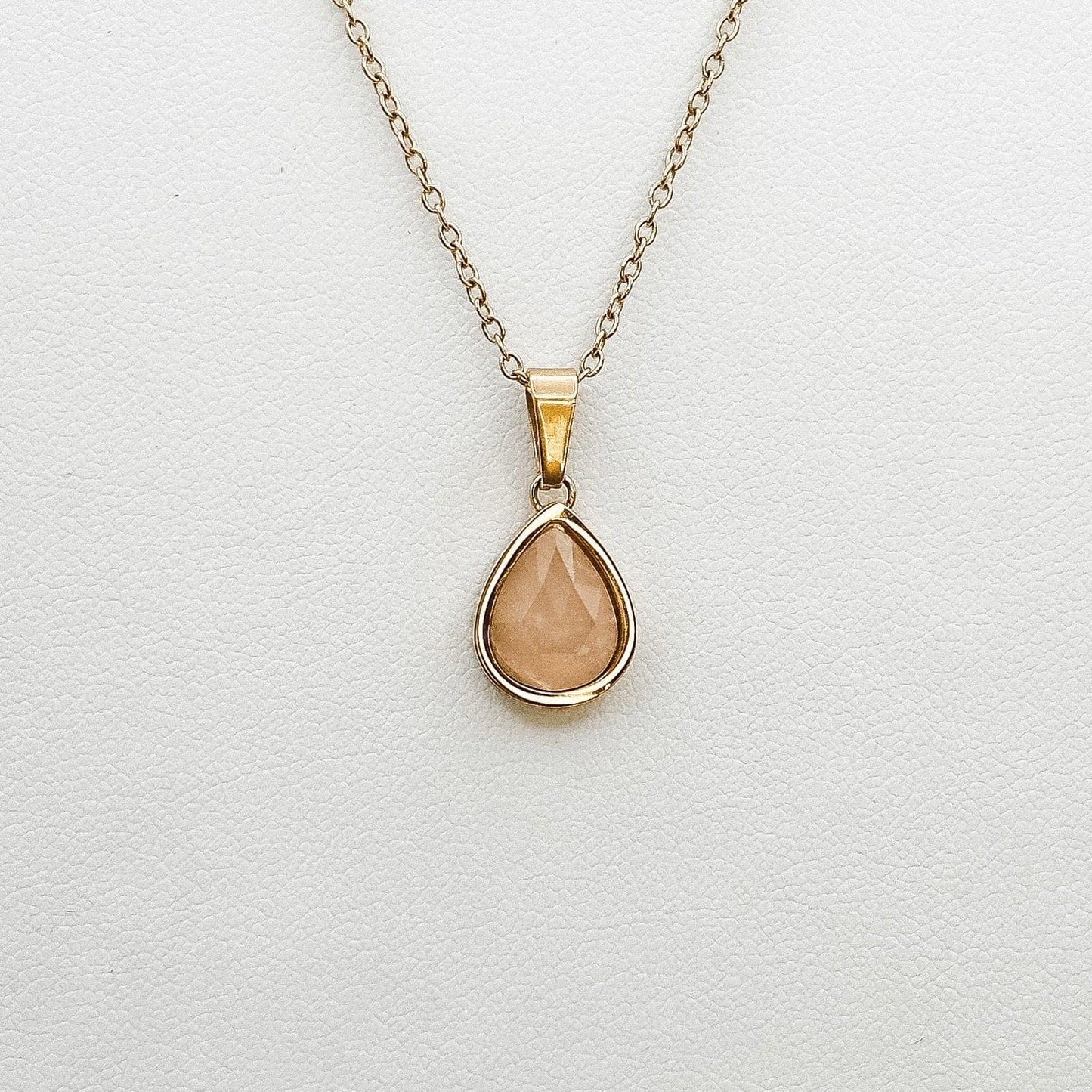 drop shape  rose quartz stone in gold plated setting  necklace